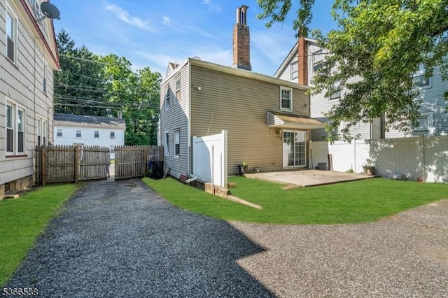 853 Westfield Ave, Rahway City, NJ 07065 - rear view of house featuring a patio area and a chimney