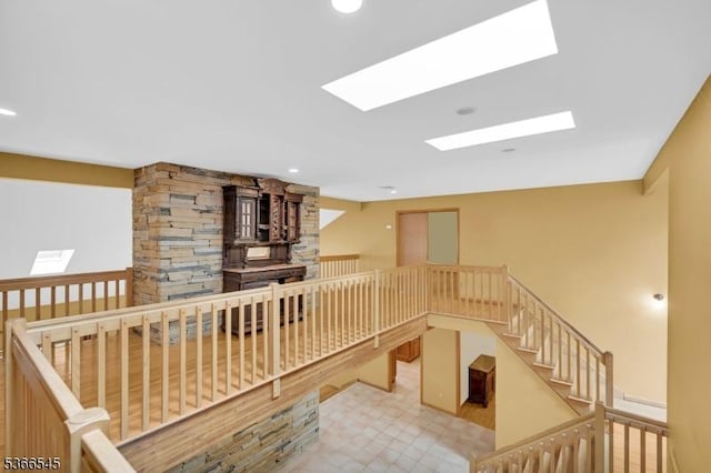 86 Underrock Rd, Sparta Twp, NJ 07871 - corridor featuring a skylight, an upstairs landing, recessed lighting, and tile patterned floors