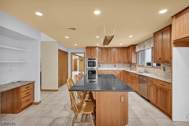 86 Underrock Rd, Sparta Twp, NJ 07871 - kitchen with appliances with stainless steel finishes, decorative backsplash, open shelves, a center island, and a kitchen bar