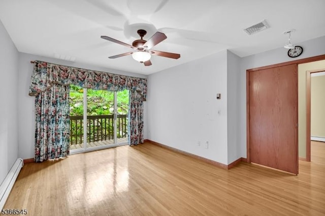 86 Underrock Rd, Sparta Twp, NJ 07871 - spare room featuring a baseboard heating unit, a ceiling fan, and light wood-style flooring