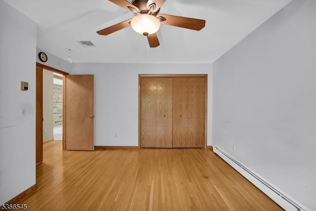 86 Underrock Rd, Sparta Twp, NJ 07871 - unfurnished bedroom featuring baseboard heating, light wood-style floors, a closet, and ceiling fan