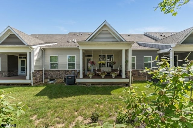 7 Harrier Ln, Washington Twp, NJ 07882 - back of property featuring stone siding, a lawn, a porch, and roof with shingles