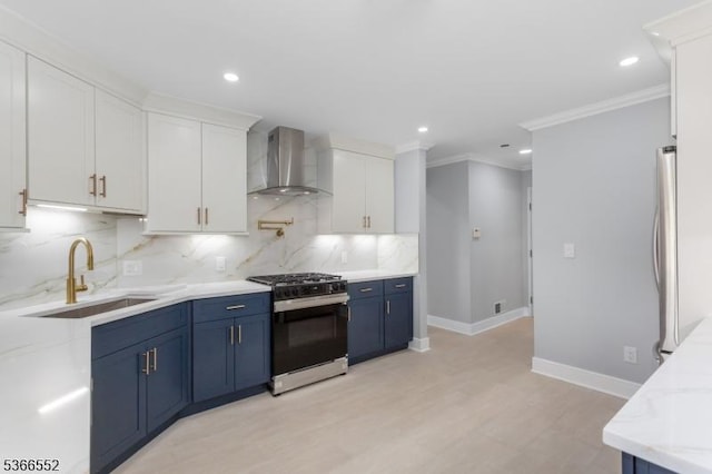 604 Skyline Dr Unit 604, Haledon Boro, NJ 07508 - kitchen with wall chimney range hood, gas range, blue cabinets, white cabinetry, and light wood-type flooring
