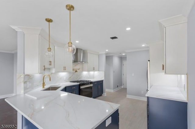 604 Skyline Dr Unit 604, Haledon Boro, NJ 07508 - kitchen with wall chimney exhaust hood, gas stove, blue cabinetry, tasteful backsplash, and ornamental molding