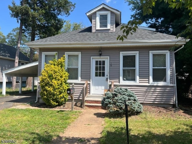 16 Ransome Pl, Plainfield City, NJ 07063 - view of front of property with a carport, a shingled roof, and a front yard