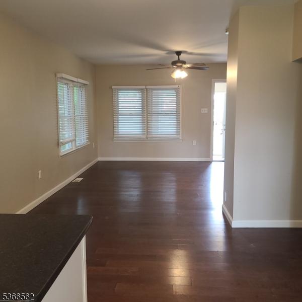 16 Ransome Pl, Plainfield City, NJ 07063 - unfurnished living room with a ceiling fan and dark wood-style flooring