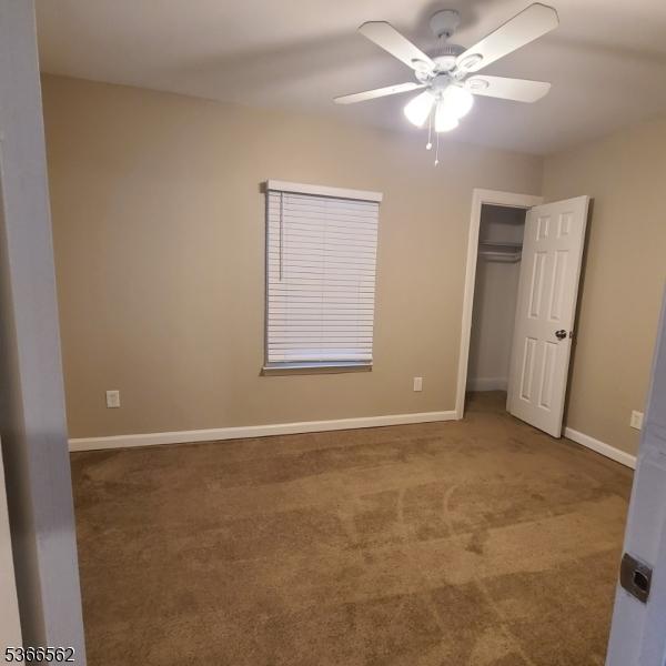 16 Ransome Pl, Plainfield City, NJ 07063 - unfurnished bedroom with carpet, a closet, and ceiling fan