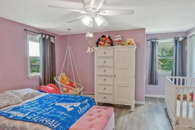 93 Meacham Ave, Nutley Twp, NJ 07110 - bedroom featuring wood finished floors, multiple windows, and ceiling fan