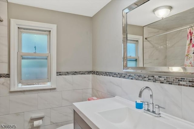 93 Meacham Ave, Nutley Twp, NJ 07110 - full bathroom with curtained shower, vanity, healthy amount of natural light, and tile walls