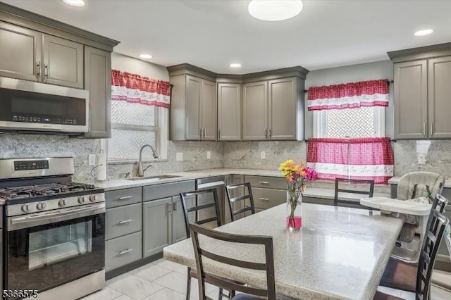 93 Meacham Ave, Nutley Twp, NJ 07110 - kitchen with appliances with stainless steel finishes, gray cabinetry, tasteful backsplash, and recessed lighting