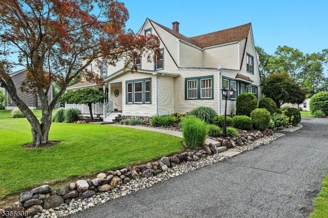 169 Knoll Rd, Parsippany-Troy Hills Twp, NJ 07005 - view of side of home with a yard, a chimney, and a shingled roof
