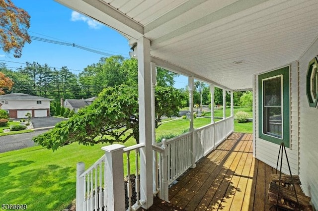169 Knoll Rd, Parsippany-Troy Hills Twp, NJ 07005 - wooden porch featuring a yard