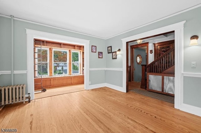 169 Knoll Rd, Parsippany-Troy Hills Twp, NJ 07005 - empty room with wood finished floors, radiator, and crown molding