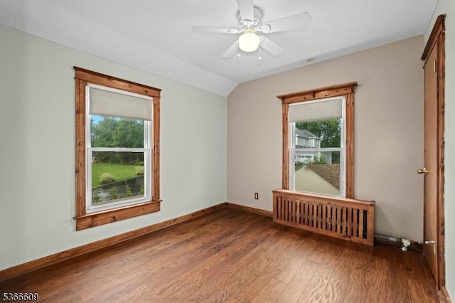 169 Knoll Rd, Parsippany-Troy Hills Twp, NJ 07005 - spare room with plenty of natural light, wood finished floors, radiator heating unit, ceiling fan, and vaulted ceiling