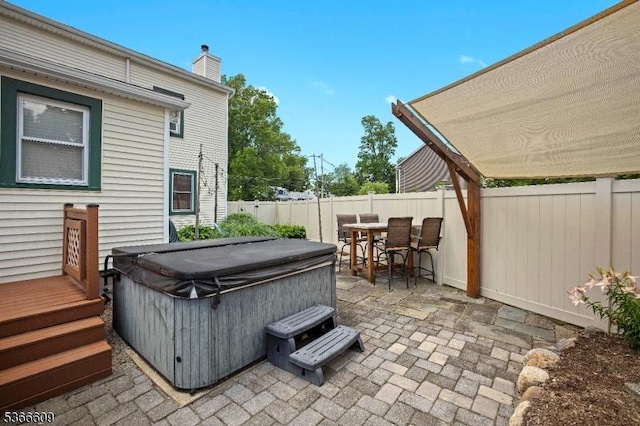 169 Knoll Rd, Parsippany-Troy Hills Twp, NJ 07005 - fenced backyard featuring a hot tub, a patio area, and outdoor dining space