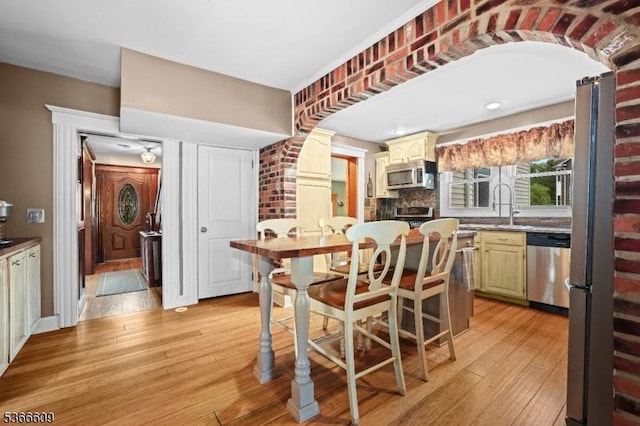 169 Knoll Rd, Parsippany-Troy Hills Twp, NJ 07005 - dining space with light wood-type flooring and arched walkways