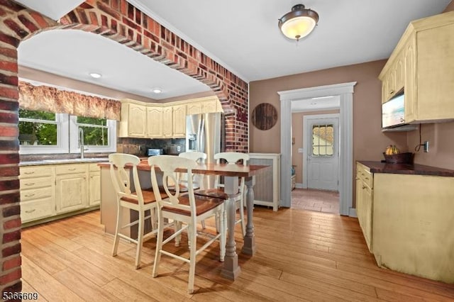 169 Knoll Rd, Parsippany-Troy Hills Twp, NJ 07005 - kitchen with stainless steel fridge, light wood-style floors, and decorative backsplash