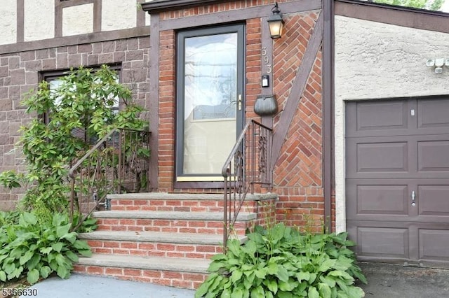 393 High St, Nutley Twp, NJ 07110 - doorway to property featuring brick siding and a garage