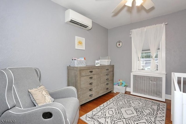 393 High St, Nutley Twp, NJ 07110 - sitting room with a wall mounted air conditioner, ceiling fan, wood finished floors, and radiator heating unit
