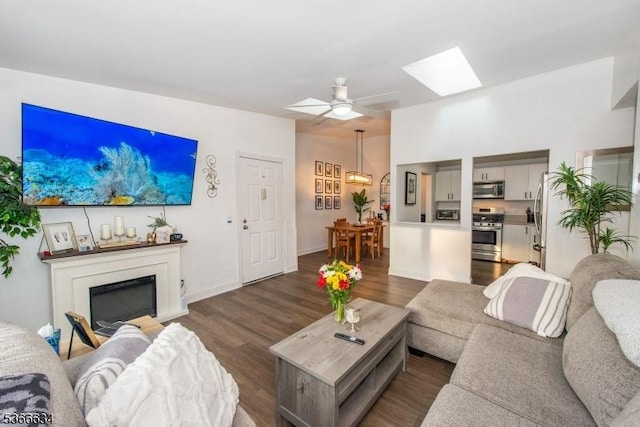 204 Robertson Way Unit 204, Lincoln Park Boro, NJ 07035 - living area with a skylight, dark wood-style floors, a fireplace, a chandelier, and a ceiling fan