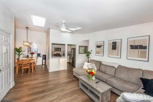 204 Robertson Way Unit 204, Lincoln Park Boro, NJ 07035 - living area featuring a skylight, dark wood-style flooring, ceiling fan, and a chandelier
