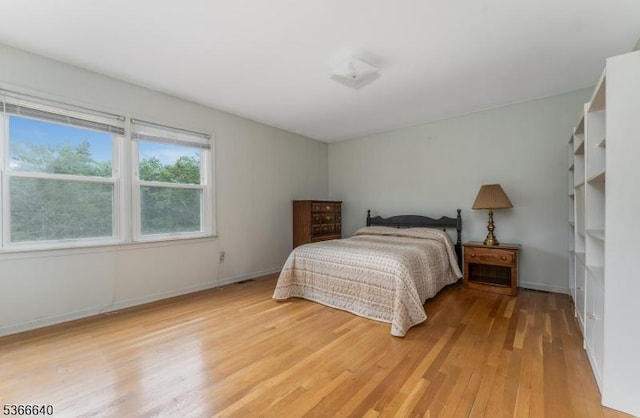 836 Dow Rd, Bridgewater Twp, NJ 08807 - bedroom with light wood finished floors and baseboards