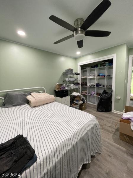 23D Hanover Sq Unit 23, Middlesex Boro, NJ 08846 - bedroom featuring wood finished floors, a closet, ceiling fan, and recessed lighting