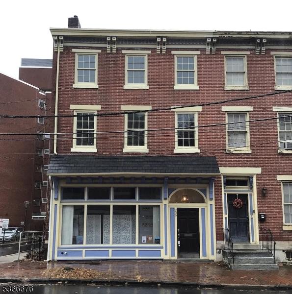 209 E Front St, Trenton City, NJ 08611 - view of front of house featuring brick siding and cooling unit