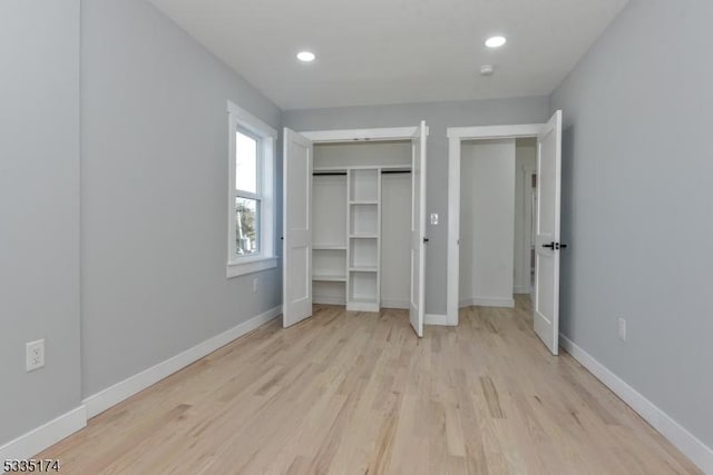 584 Lake Shore Dr, West Milford Twp, NJ 07421 - unfurnished bedroom featuring light wood-type flooring, recessed lighting, and a closet