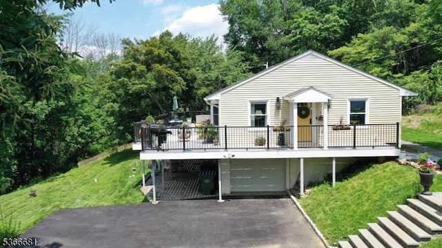 306 W Valley Brook Rd, Washington Twp, NJ 07830 - view of front of property with a garage, driveway, a front yard, and a wooden deck