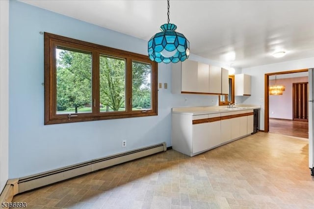 31 Casper Berger Rd, Readington Twp, NJ 08889 - kitchen featuring a baseboard radiator, light countertops, white cabinetry, hanging light fixtures, and a chandelier