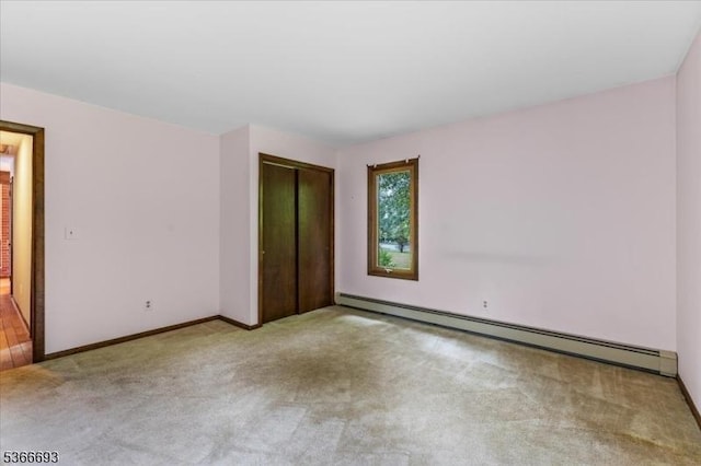 31 Casper Berger Rd, Readington Twp, NJ 08889 - unfurnished bedroom with baseboard heating, carpet floors, and a closet