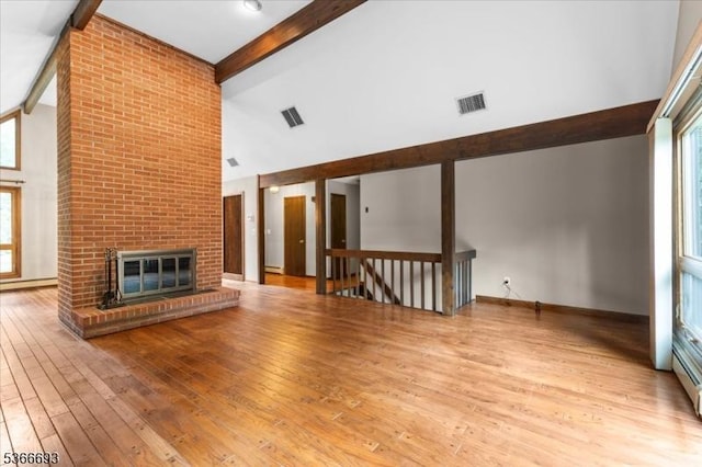 31 Casper Berger Rd, Readington Twp, NJ 08889 - unfurnished living room featuring high vaulted ceiling, beam ceiling, wood-type flooring, and a brick fireplace