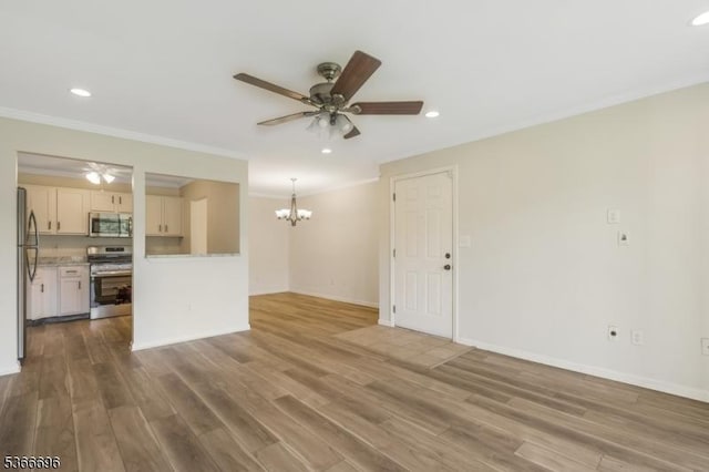 2909 Lindsley Rd, Bridgewater Twp, NJ 08807 - unfurnished living room featuring a ceiling fan, a chandelier, crown molding, wood finished floors, and recessed lighting