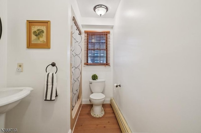15 Woglum Pl, Berkeley Heights Twp, NJ 07922 - bathroom featuring wood finished floors, a baseboard radiator, and a shower with shower curtain