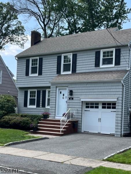 107 Oak Ln, Cranford Twp, NJ 07016 - view of front of property with a chimney, an attached garage, and roof with shingles