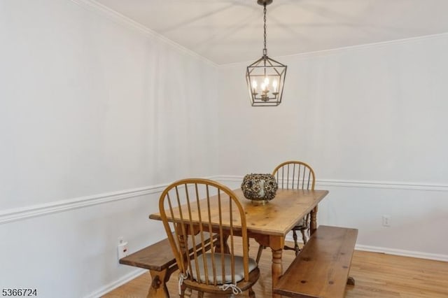 227 Potomac Dr, Bernards Twp, NJ 07920 - dining area with a chandelier, ornamental molding, and light wood-style flooring