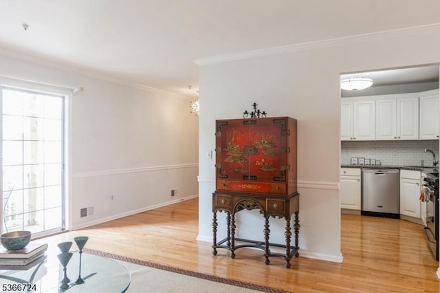 227 Potomac Dr, Bernards Twp, NJ 07920 - dining room featuring light wood-style floors and crown molding