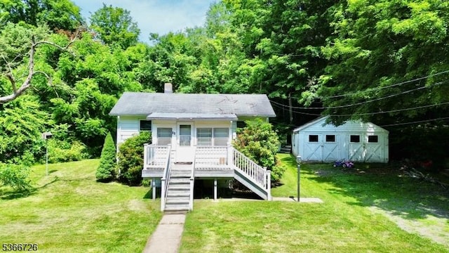 55 Taylor Rd, Jefferson Twp, NJ 07885 - view of front of home with a front yard, stairway, an outbuilding, and a chimney