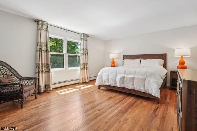 4 Dickens Ct, Morris Twp, NJ 07960 - bedroom with light wood-style floors and baseboard heating