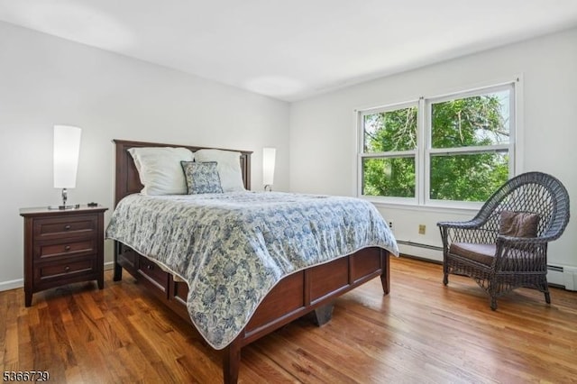4 Dickens Ct, Morris Twp, NJ 07960 - bedroom featuring dark wood-style flooring and baseboard heating
