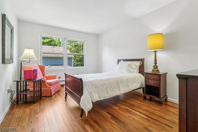 4 Dickens Ct, Morris Twp, NJ 07960 - bedroom with hardwood / wood-style flooring and a baseboard heating unit