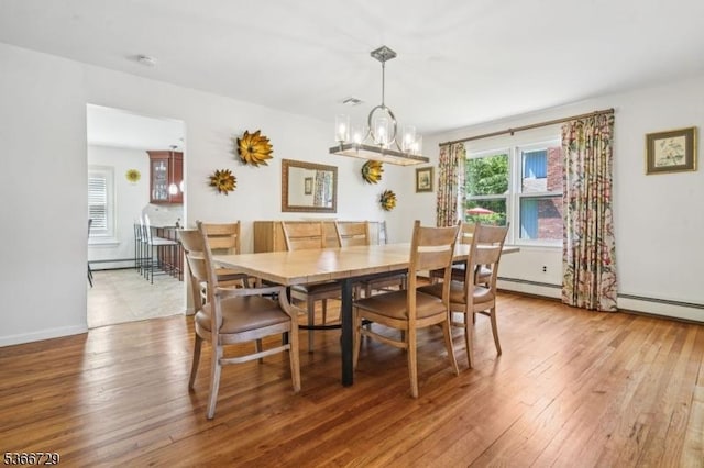 4 Dickens Ct, Morris Twp, NJ 07960 - dining room featuring a chandelier, wood-type flooring, and baseboard heating
