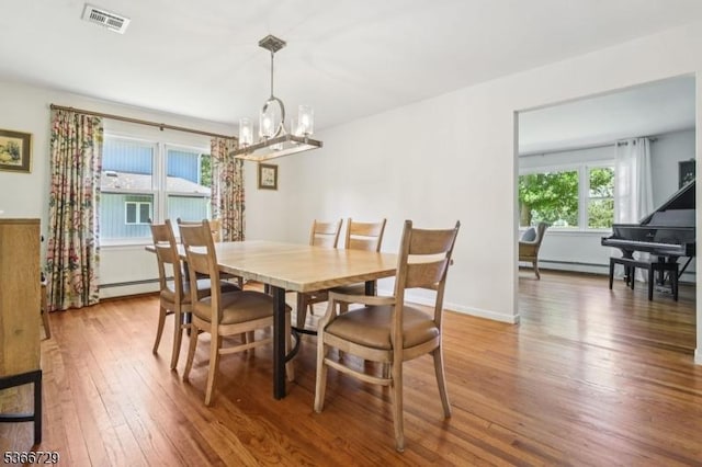 4 Dickens Ct, Morris Twp, NJ 07960 - dining area featuring a chandelier, hardwood / wood-style floors, and baseboard heating