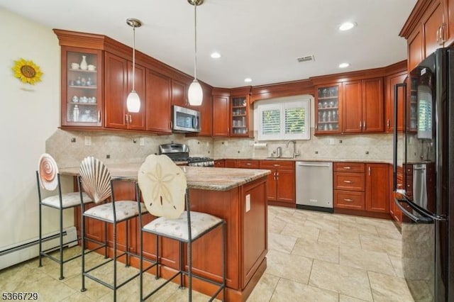 4 Dickens Ct, Morris Twp, NJ 07960 - kitchen featuring appliances with stainless steel finishes, a peninsula, light stone countertops, baseboard heating, and pendant lighting