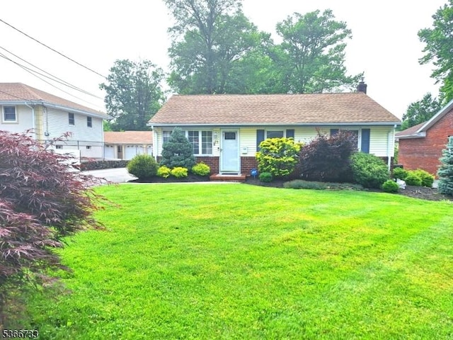 21 Fagan Pl, Woodbridge Twp, NJ 07067 - view of front of home featuring a front lawn, brick siding, and a chimney