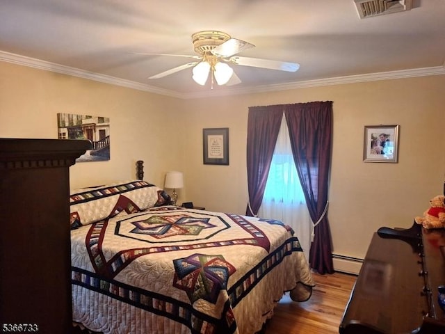 21 Fagan Pl, Woodbridge Twp, NJ 07067 - bedroom with crown molding, wood finished floors, a baseboard heating unit, and a ceiling fan