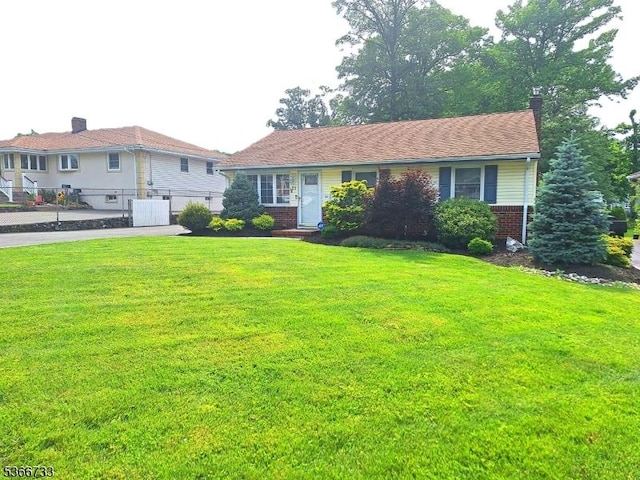 21 Fagan Pl, Woodbridge Twp, NJ 07067 - view of front of home with brick siding and a chimney