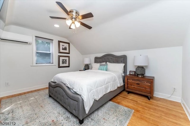 608 Duquesne Ter, Union Twp, NJ 07083 - bedroom with lofted ceiling, an AC wall unit, light wood finished floors, and ceiling fan