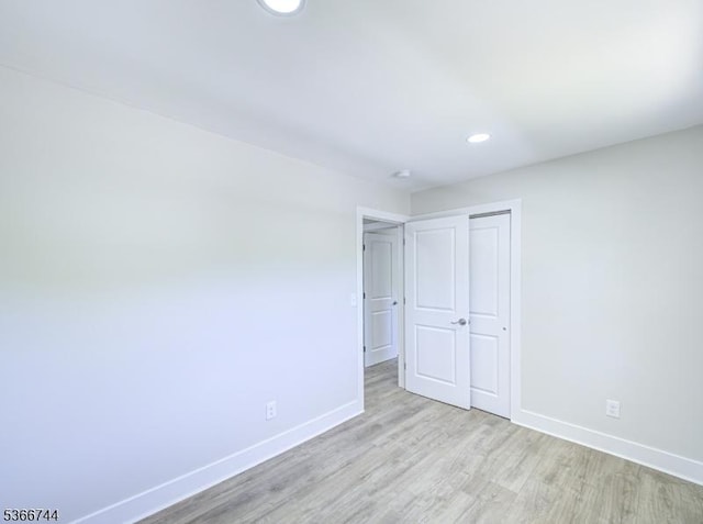 44 Sullivan Way E, Brunswick Twp, NJ 08816 - unfurnished bedroom with light wood-style flooring, recessed lighting, and a closet